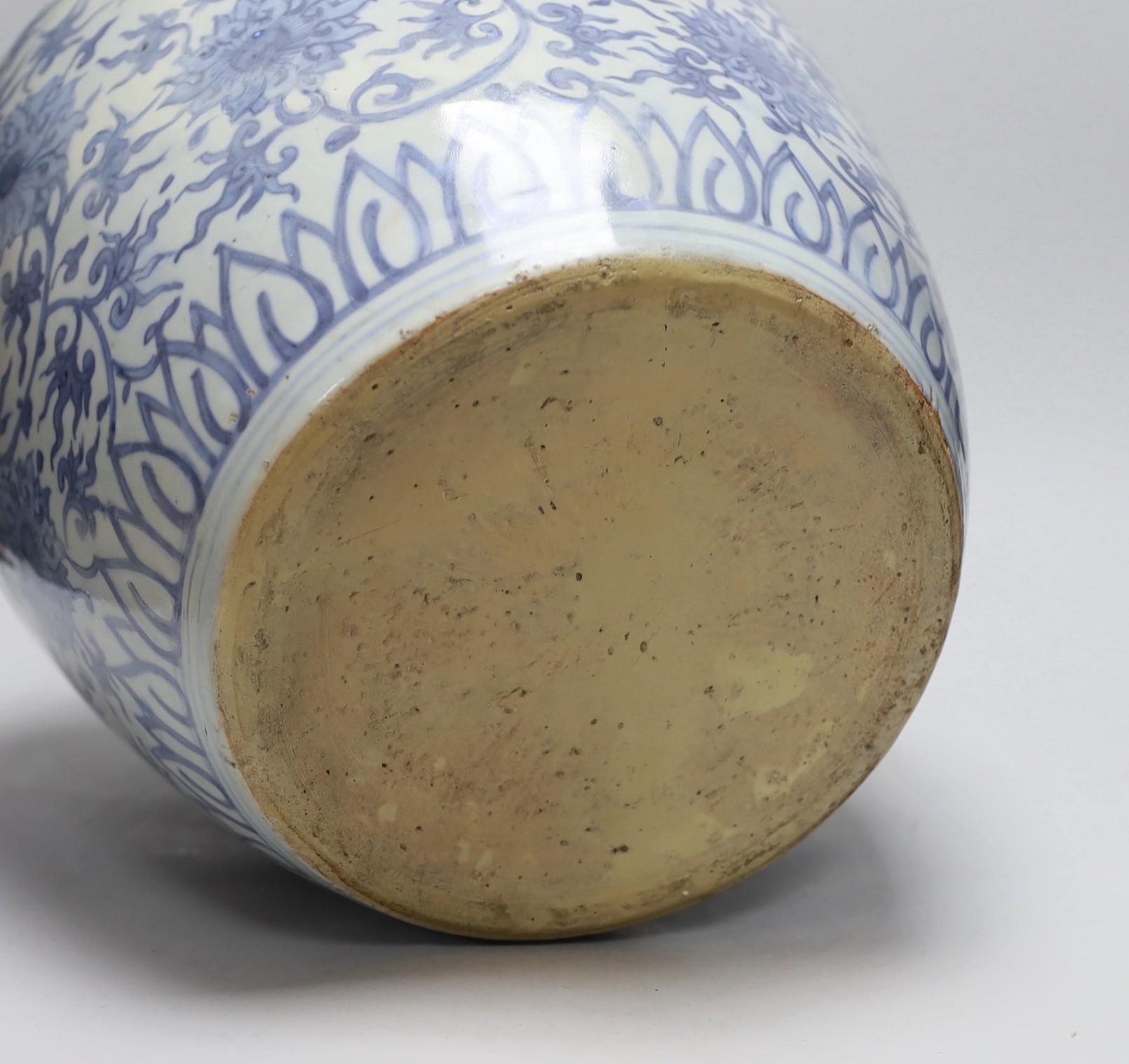 A Chinese blue and white 'lotus' jar, 17th century, 38cms high, restored